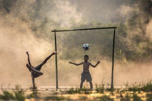 children, splash, asia, sunset, thailand, kick, boys, ball, myanmar, burma, nature, countryside, outdoor, malaysia, kids, exercise, vietnamese, game, sports, friend, indonesian, outside, goal, play, cambodia, football, goal post, brown exercise, brown sun