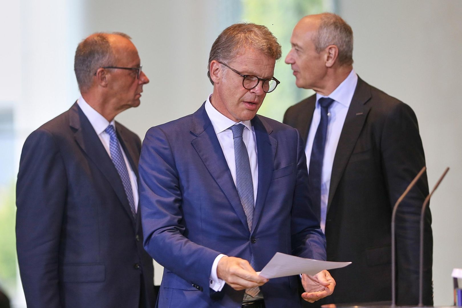 Friedrich Merz, Christian Sewing und Roland Busch am 21.07.2025