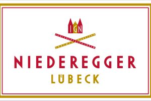 Preiskampf, Zollschock und Kakaokrise – wie Niederegger gegen den Strom schwimmt